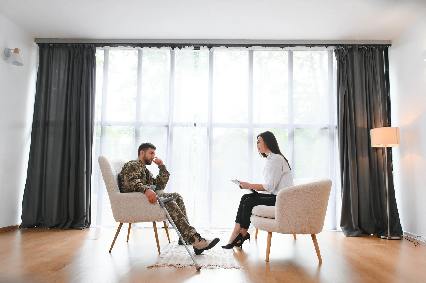 A service member in a supportive conversation with a counselor