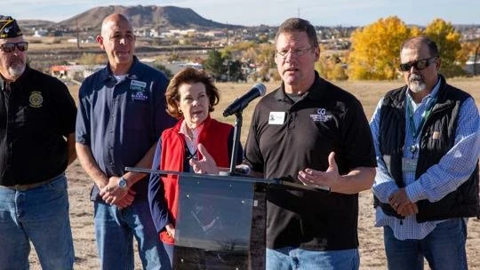 Heroes Hall representatives speaking outdoors with community members