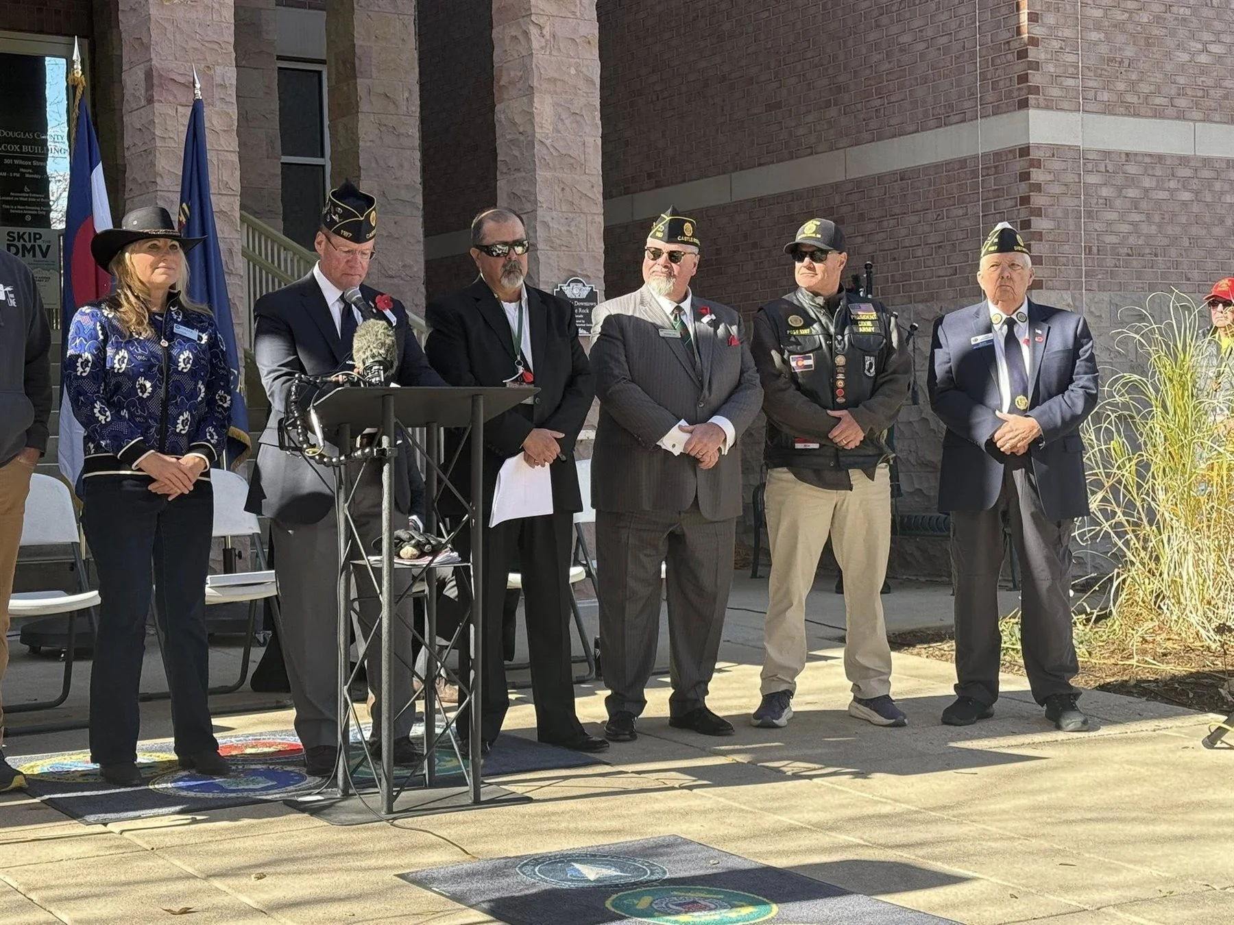 Local veterans and community leaders gathered outside a Douglas County building